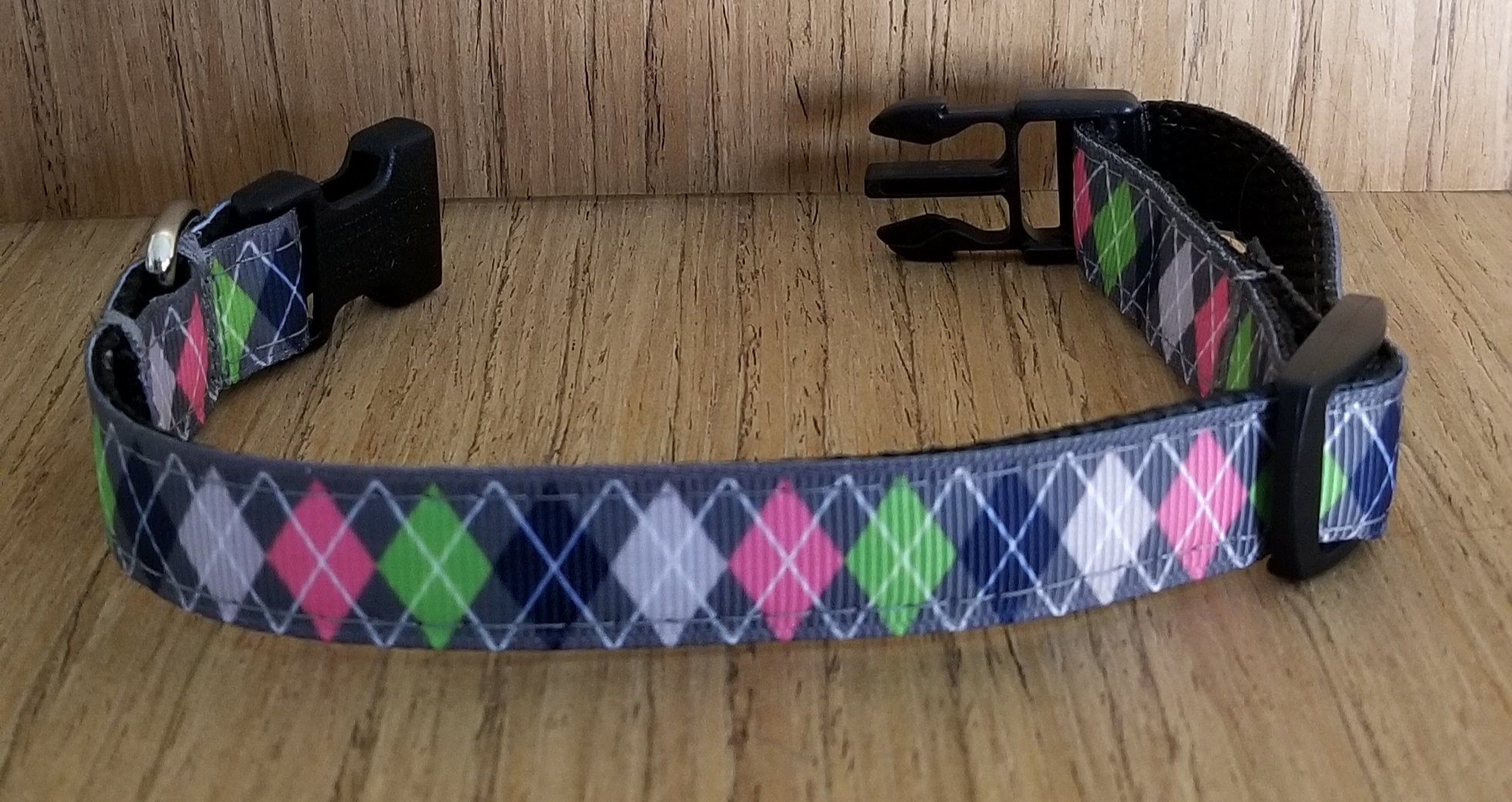 A stylish Pink, Green, Blue & Grey Argyle collar for medium to large pets, showcasing its vibrant colors and sturdy design.